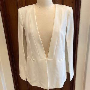 Cape style jacket and fitted pants. Jacket is large , pants are size 8